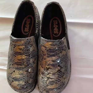 Ladies size 7 Klogs silver,gold and black. New w/o tags.